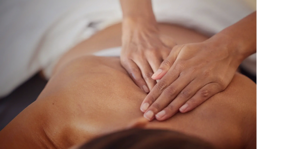 Swedish relaxation massage on back at Honey In Hand Spa in Bigfork, Montana