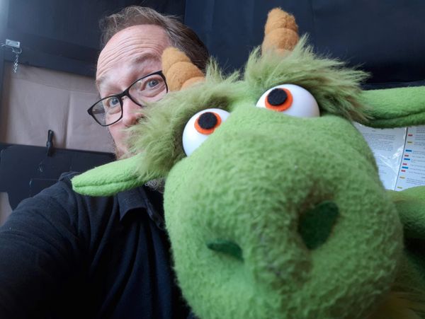 Dave Rozmarynowski, founder of Roz Puppets, and the Dragon from George and the Dragon puppet show