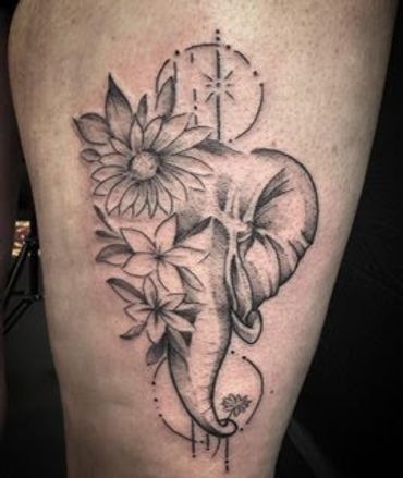 elephant with flowers tattoo