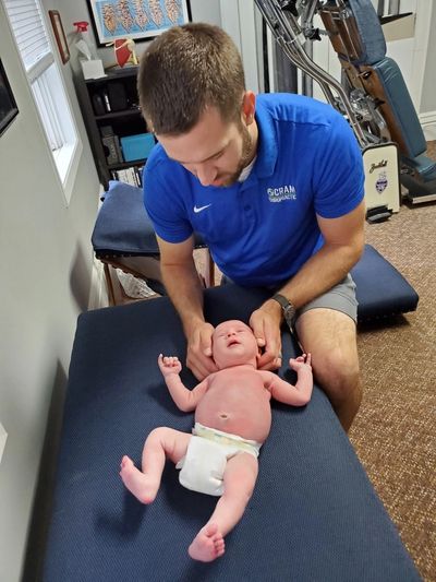 DeWitt Chiropractor Cram helps with ear infections, colic, latching, neck pain, back pain, hip issue