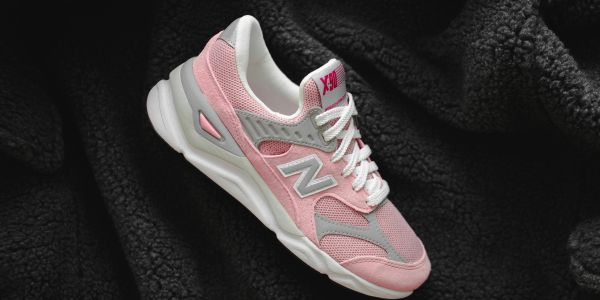 Pink and gray sneaker with white laces.