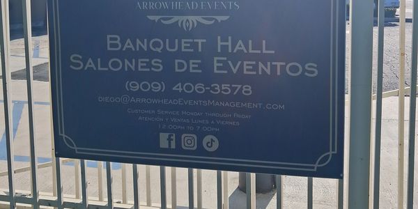 Sign for Arrowhead Events Banquet Hall with contact information.