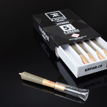 Pack of Kaviar pre-rolled cannabis joints with one joint outside the box.