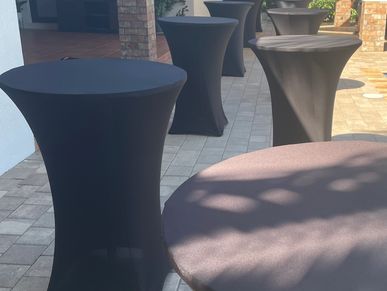 black spandex cover and cocktail table