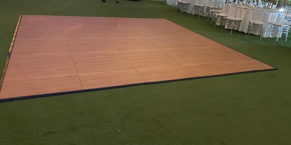15x15 portable dance floor in maple style on grass 