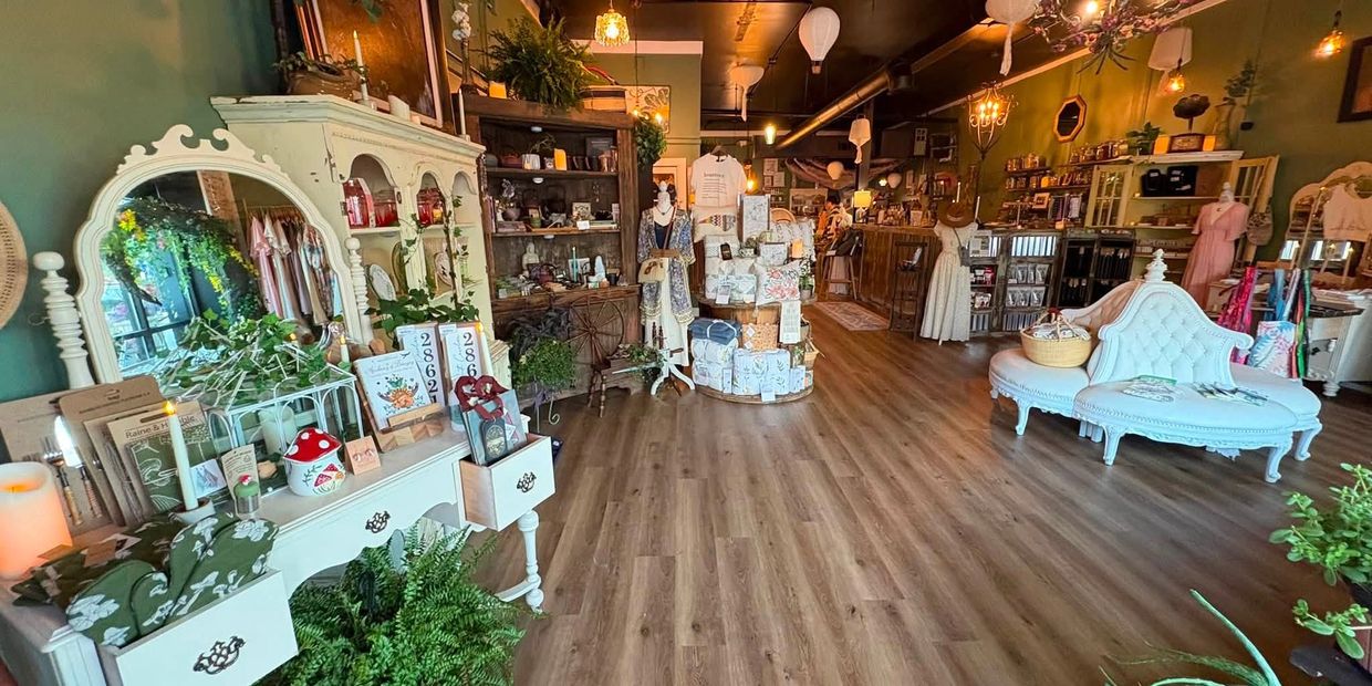 Cozy boutique with vintage furniture and assorted decor items.