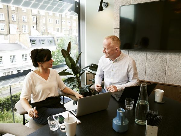 Two business people having a meeting in an office