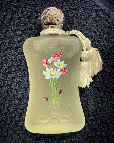 San Diego bottle painter Parfums de Marly blue daisies, rose buds and lady bugs