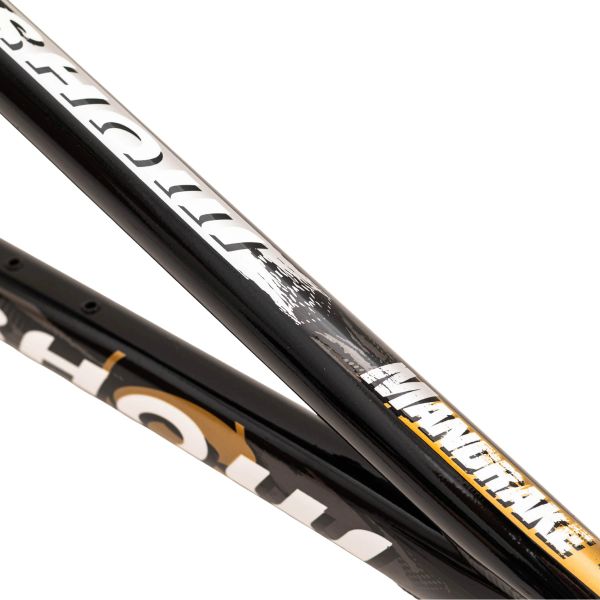 Close-up of black hockey sticks with white and orange text.