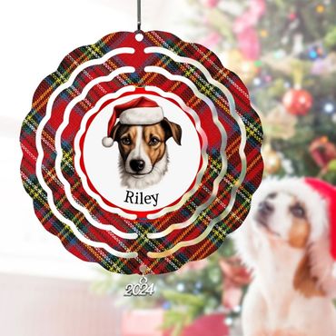 4" round wind spinner featuring a plaid background, an image of a dog wearing a Santa hat and the pe