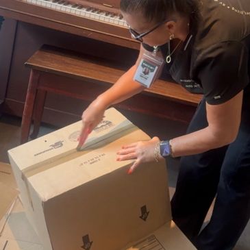 Theresa Villars head of Details By Lady T packing for a client during her packing service