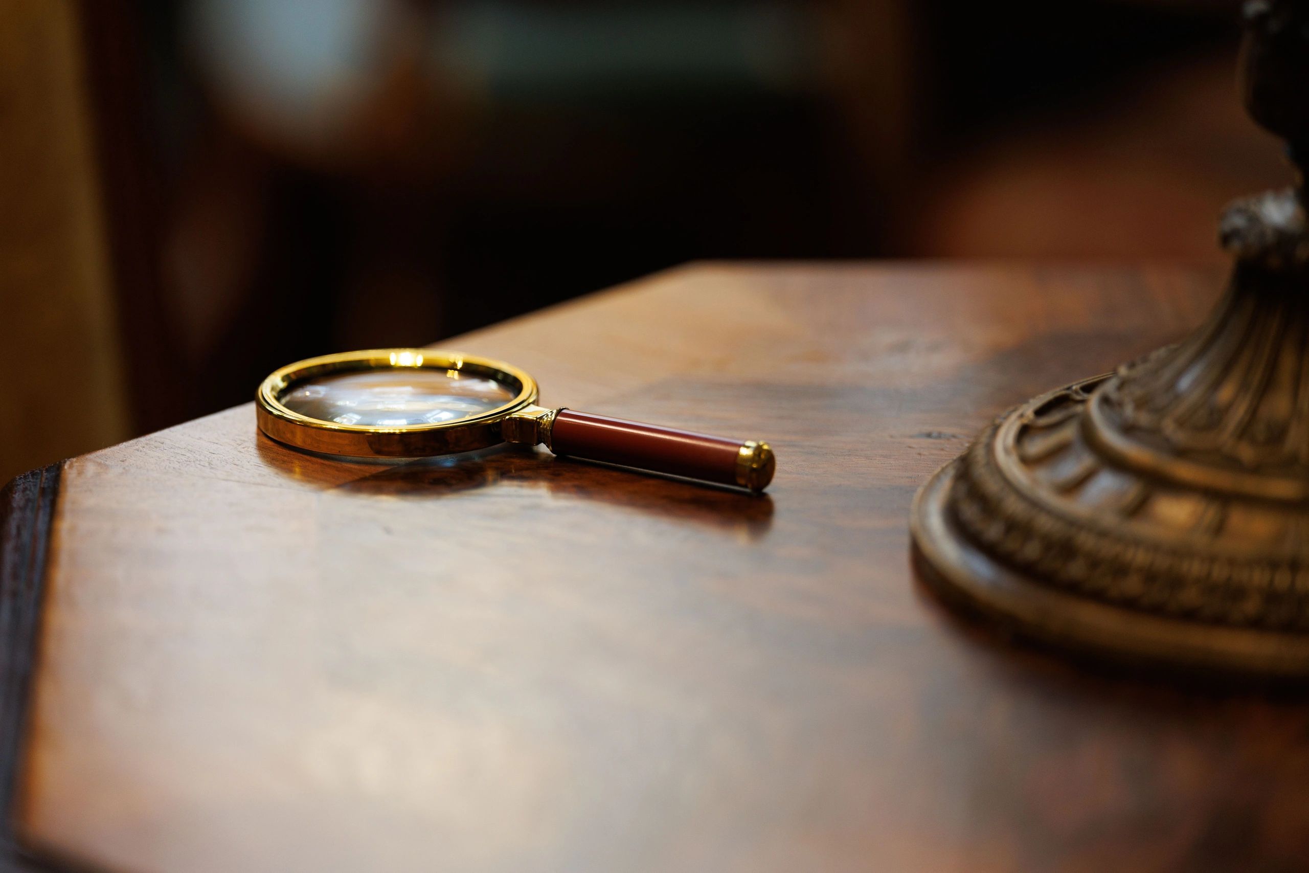 Magnifying glass on a wooden table.