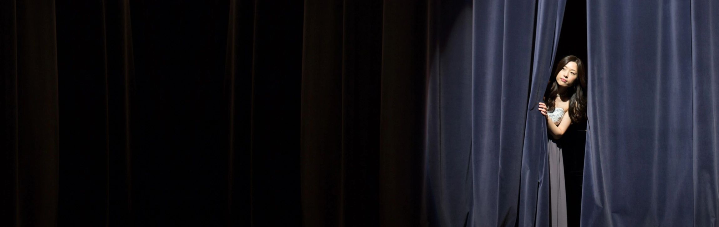Peering from a behind the stage curtain, an authentic Human soul prepares to become a main character
