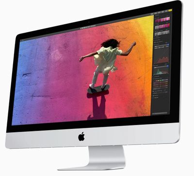 iMac computer with colorful image of girl skateboard on the screen