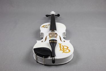 White 3d printed violin with gold designs on a gray background.