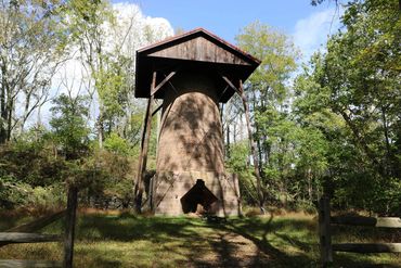 Stone tower in the woods.