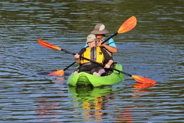 Two people paddling a kayak.
