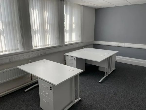 Modern office room with empty white desks