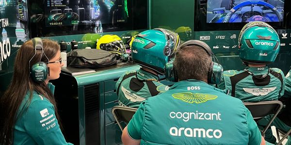 Aston Martin F1 team members monitoring a race.