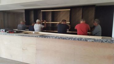 The new bar shelves in Hornby Park clubhouse being put up.