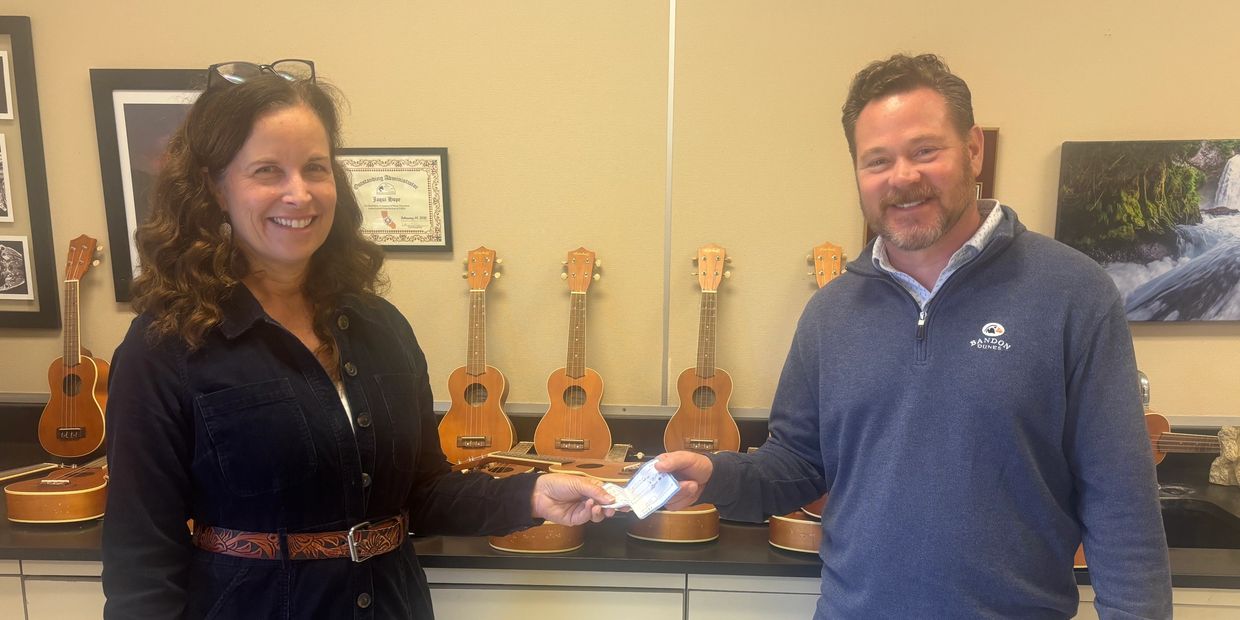 MusicFest representatives present a donation supporting MPUSD Visual & Performing Arts programs.