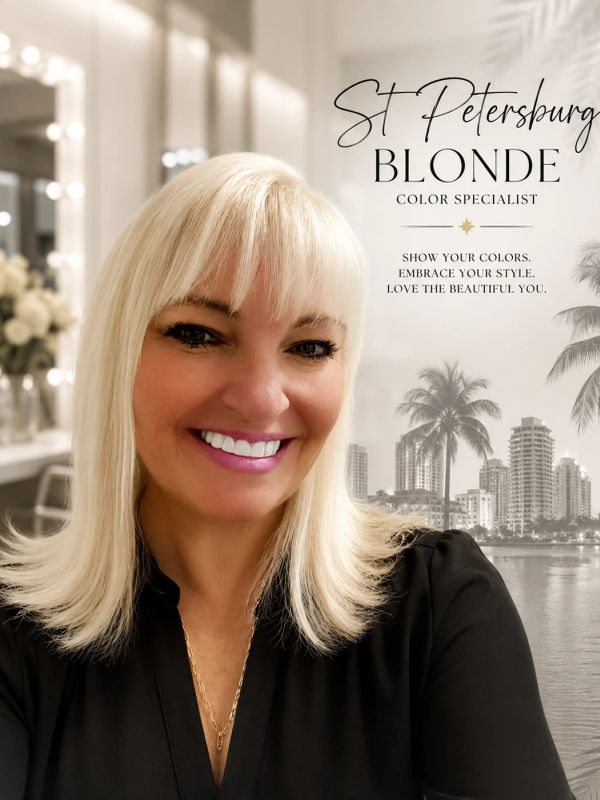 Smiling blonde woman with city and palm trees background.