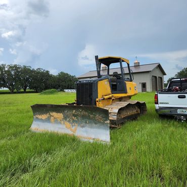 trackhoe bulldozer dozer asphalt building pad