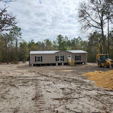 backhoe tractor new construction lime rock