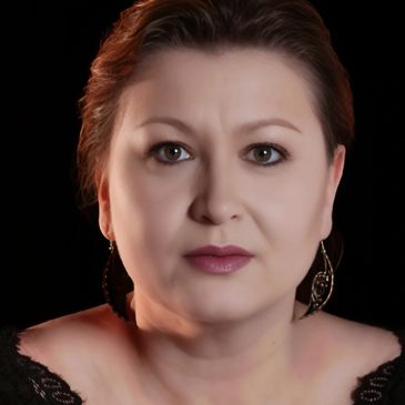 Lovely Polish woman with sincere look, dangling earring.