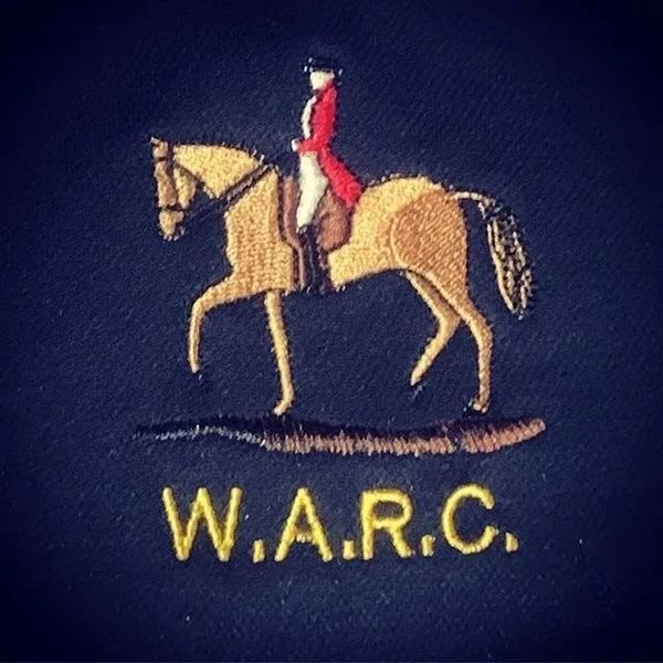 Embroidered logo of a rider on a horse with W.A.R.C. text below.