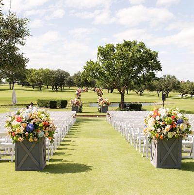 White Garden Chairs set up for a Wedding Ceremony in Dallas TX