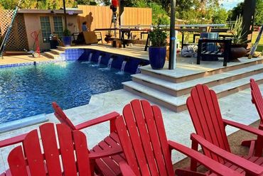 Waterline and wall tile installation, plus full travertine around the pool and on the steps - a clea