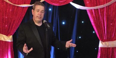 a man talking into a microphone