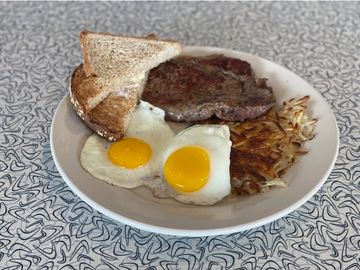 Hand cut ribeye with 2 eggs, hashbrowns and toast