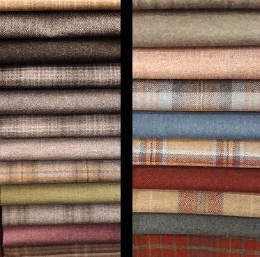 Two stacks of folded fabric in earthy and muted tones.
