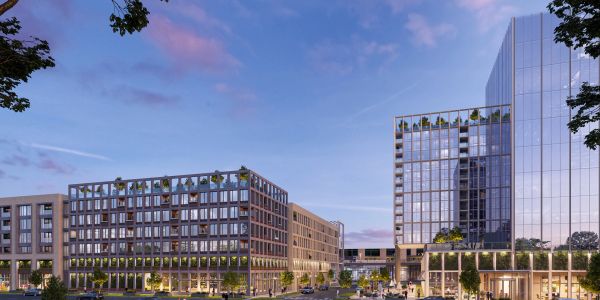 Modern office buildings with glass facades at dusk.