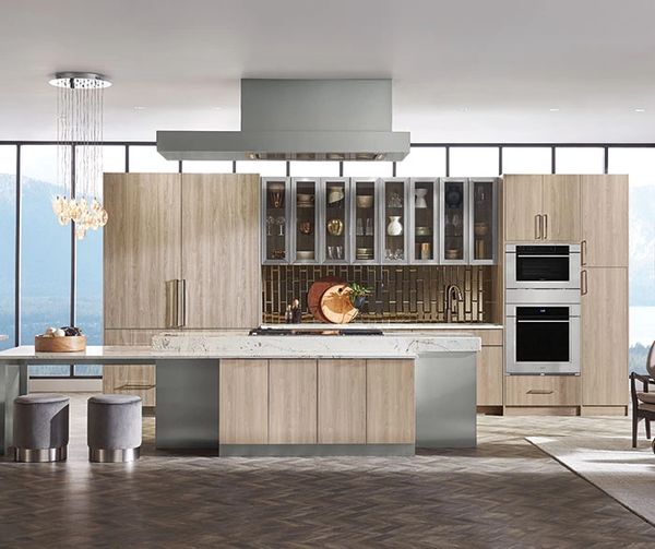Sleek modern kitchen with white high-gloss cabinets, gray wood-look tile flooring, and minimalist