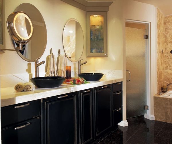 Contemporary bathroom with black cabinetry, white countertop, and light wood-look tile flooring