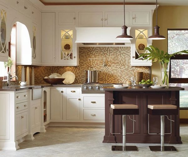 Casual kitchen with light maple cabinetry, stone backsplash, and tile flooring by Floors N More