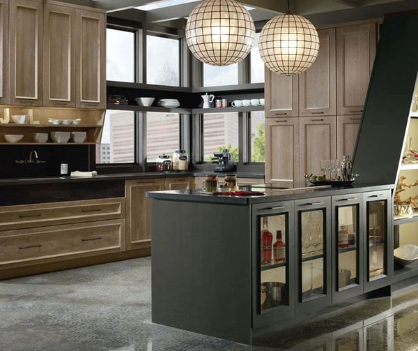 Modern kitchen with rich wenge wood cabinets, light tile flooring, and stainless steel appliances