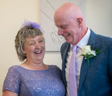 A joyful mature couple sharing a happy moment together indoors.