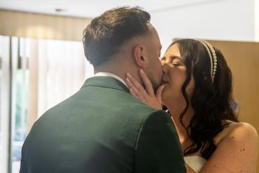 A couple sharing a tender kiss during a special moment.