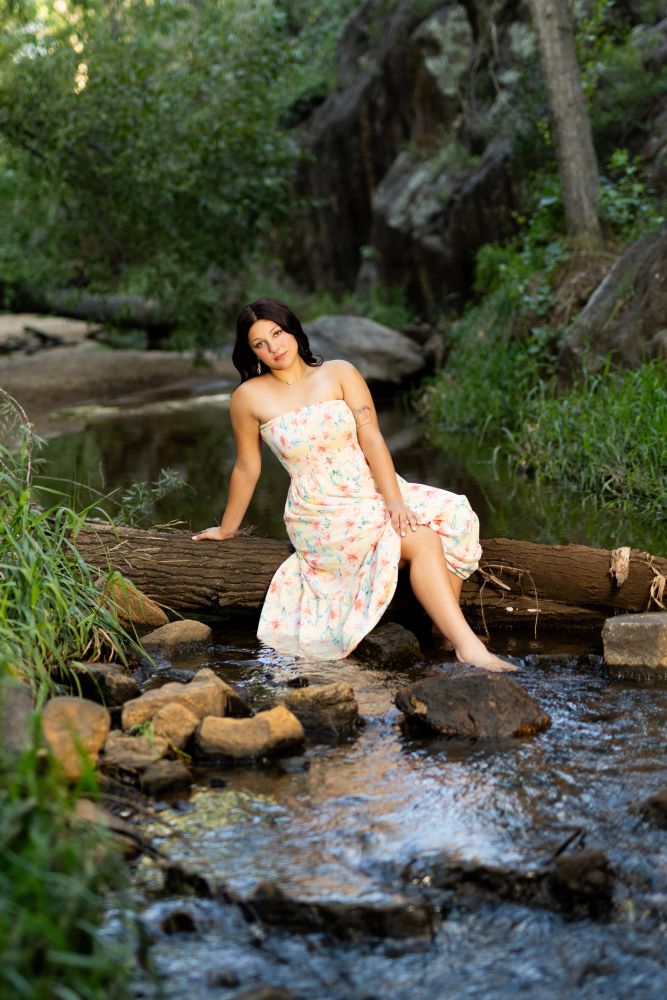 Class of 2027 senior photos in creek and forest