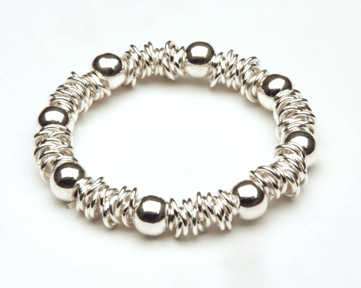 Bracelets: Elastic or adjustable with beads or sterling silver.