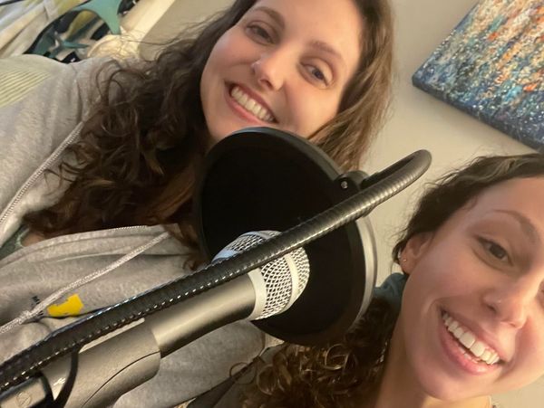 Hosts, Anna and Olivia, preparing to record the podcast.