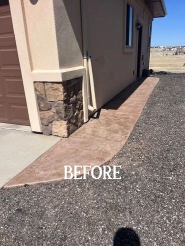 Concrete pathway alongside a house before any landscaping.