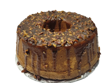 Chocolate bundt cake with pecan topping and glaze.