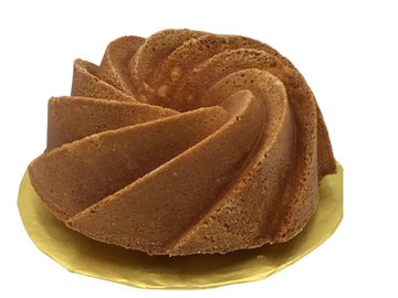 A golden brown bundt cake with a spiral design on a yellow plate.