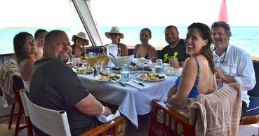 Guests having lunch at the aft deck table. The yachting experience at this best