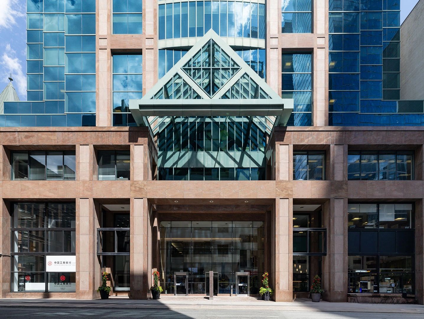 An office building with a triangular entrance canopy.